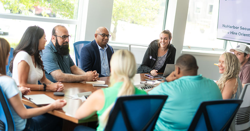a group of people at a GuardsArm new hire orientation
